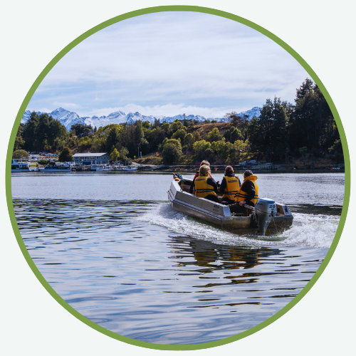 a group of people in a boat on water