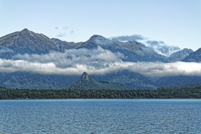 lake manapouri with mountains in the background